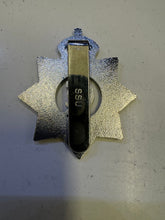 Cap badge